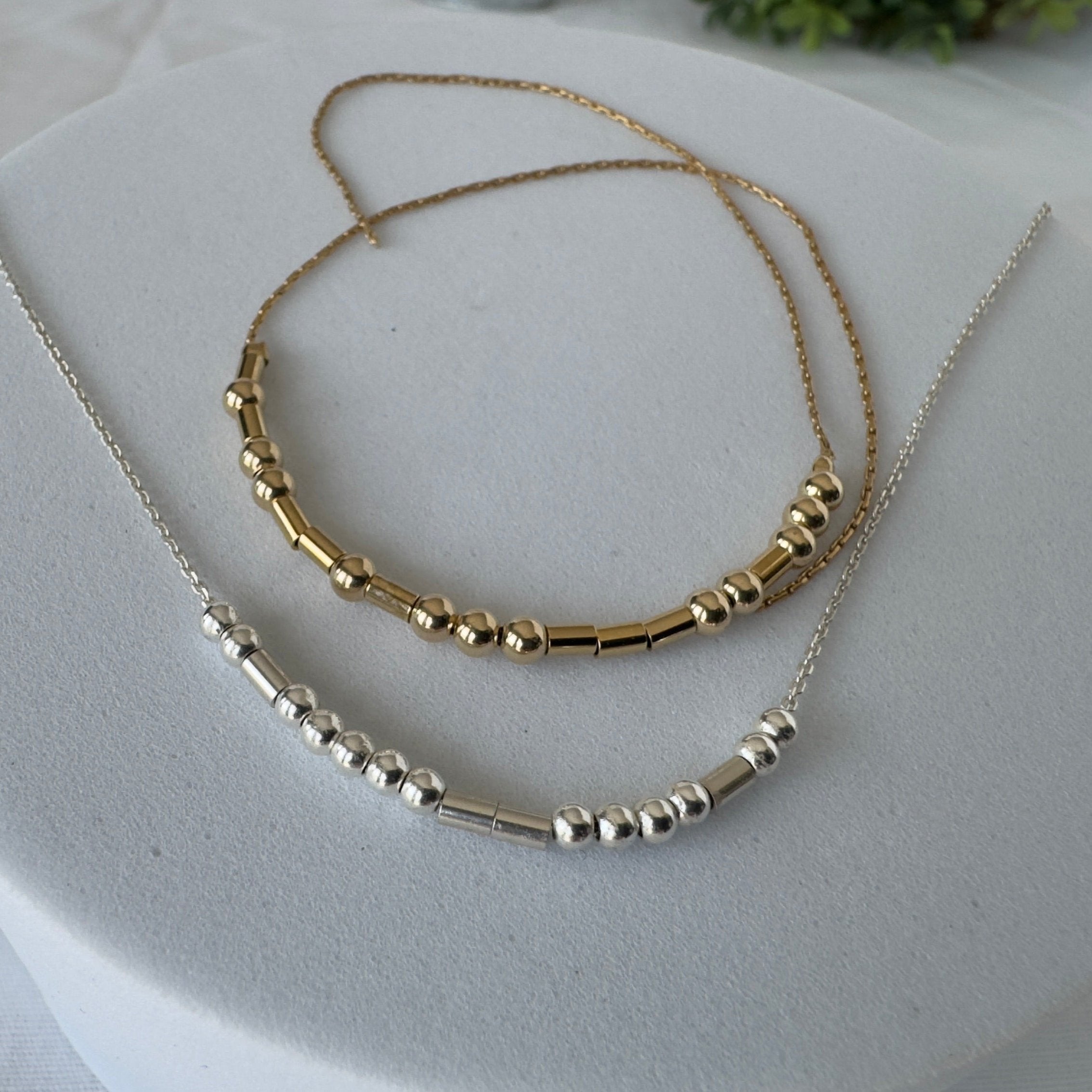 Sterling Silver 3mm round beads for dots and sterling silver tubes for dashes, on a sterling silver chain. Example shows "INSPIRE"
Bracelet -Gold-filled 3mm round beads for dots and Gold-filled tubes for dashes. strung on gold filled bead chain with and unfinished ends you can choose the length and closer
