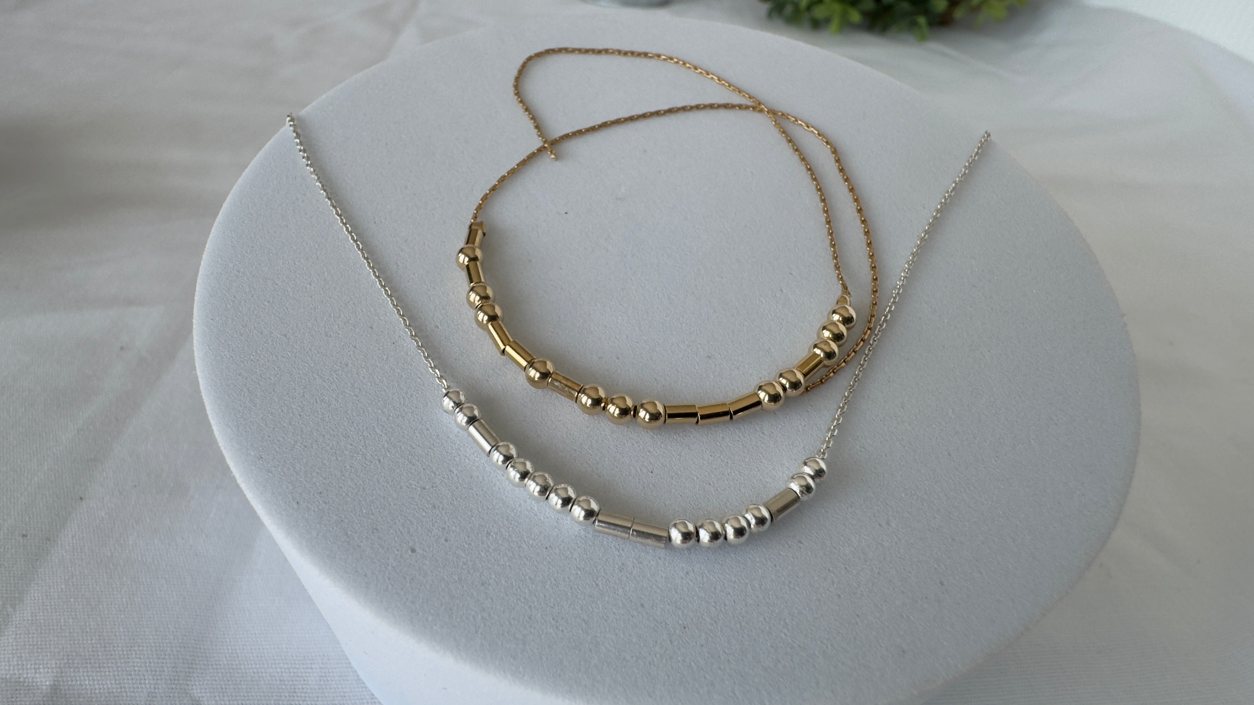 Sterling Silver 3mm round beads for dots and sterling silver tubes for dashes, on a sterling silver chain. Example shows "INSPIRE"
Bracelet -Gold-filled 3mm round beads for dots and Gold-filled tubes for dashes. strung on gold filled bead chain with and unfinished ends you can choose the length and closer