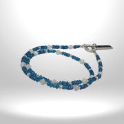 a blue and white beaded bracelet with a silver clasp