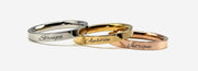 three different types of rings with names on them